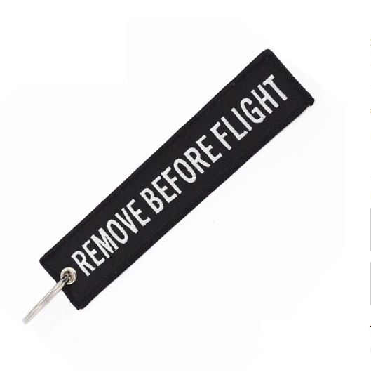 Remove before flight Zwart