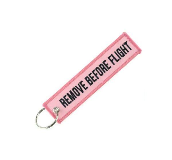 Roze sleutelhanger remove before flight